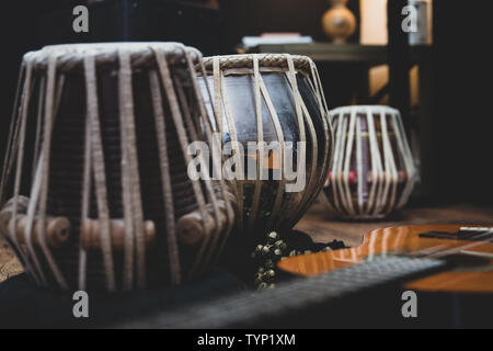 Acoustic guitar, cajon and tabla - view of the musical instruments used for fusion eastern and western music, and also jazz and blues. Stock Photo