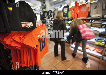 Fans shop at an official souvenir shop at Super Bowl Boulevard , a fan  experience, in New