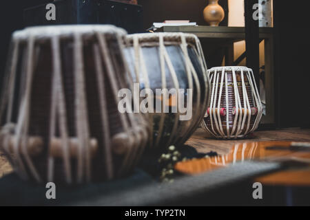 Acoustic guitar, cajon and tabla - view of the musical instruments used for fusion eastern and western music, and also jazz and blues. Stock Photo