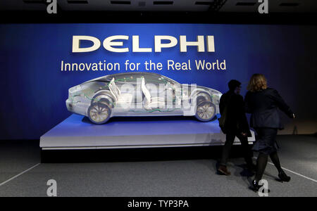 Attendees get a tour of car electrical system designs when Delphi Automotive LLP previews automated driving, engine and safety technology at the Sheraton New York Times Square Hotel in New York City on March 11, 2014.      UPI/John Angelillo Stock Photo