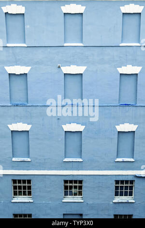 Bricked up windows in an old building in the center of an English city Stock Photo