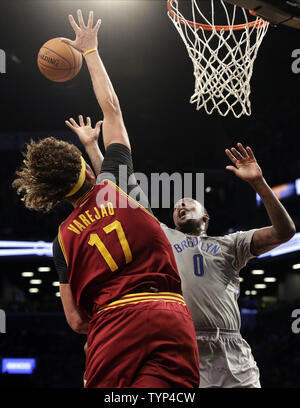 Cleveland Cavaliers Anderson Varejao tries to block a shot from Brooklyn Nets Andray Blatche in the second half at Barclays Center in New York City on March 28, 2014.The Nets defeated the Cavaliers 108-97.     UPI/John Angelillo Stock Photo
