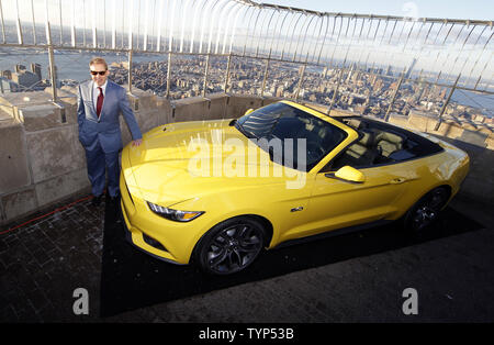 Ford Motor Company Executive Chairman Bill Ford stands with a fully assembled 2015 Mustang convertible at a press event to honor 50 years of the Ford Mustang as part of the New York International Auto Show on the observation deck of the Empire State Building in New York City on April 16, 2014.      UPI/John Angelillo Stock Photo