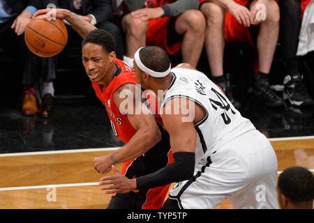 Toronto Raptors guard DeMar DeRozan (10) looks to dribble past Brooklyn Nets forward Paul Pierce (34) in the first quarter in Game 6 of the Eastern Conference Quarterfinals at Barclays Center in New York City on May 2, 2014.   UPI/Rich Kane Stock Photo