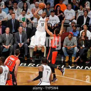 Brooklyn Nets guard Marcus Thornton (10) shoots over Toronto Raptors guard DeMar DeRozan (10) in the second quarter in Game 6 of the Eastern Conference Quarterfinals at Barclays Center in New York City on May 2, 2014.   UPI/Rich Kane Stock Photo