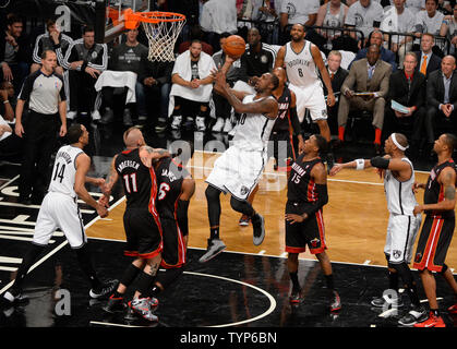 Brooklyn Nets center Andray Blatche (0) shoots over Miami Heat forward Chris Andersen (11) and Heat forward LeBron James (6) in the second quarter in Game 3 of the Eastern Conference Semifinals at Barclays Center in New York City on May 10, 2014.  UPI/Rich Kane Stock Photo