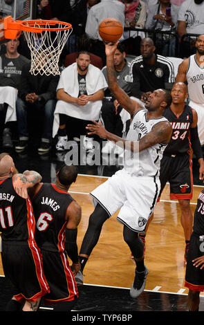 Brooklyn Nets center Andray Blatche (0) shoots over Miami Heat forward Chris Andersen (11) and Heat forward LeBron James (6) in the second quarter in Game 3 of the Eastern Conference Semifinals at Barclays Center in New York City on May 10, 2014.  UPI/Rich Kane Stock Photo