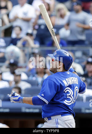 Toronto Blue Jays' Dioner Navarro watches his home run off Tampa Bay ...