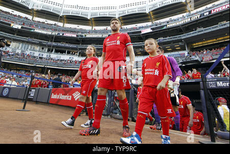 Liverpool FC Steven Gerrard enters the field before playing Manchester City at the Guinness International Champions Cup at Yankee Stadium in New York City on July 30, 2014. The Guinness International Champions Cup is a unique tournament featuring eight of the world's best and most recognizable soccer clubs including Real Madrid CF, Manchester United, Manchester City, Liverpool FC, AS Roma, Inter Milan, AC Milan and Olympiacos. The Final score was Manchester City 2 Liverpool 2 and Liverpool won 3-1 on penalties.     UPI/John Angelillo Stock Photo