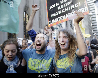 Protesters block traffic on lower Broadway near Wall Street during a rally and protest called 'Flood Wall Street' in New York City on September 22, 2014.  The protest was similar to the Occupy Wall Street set of protests but this one was more related to Climate Week and Global Warming Issues.   UPI/John Angelillo Stock Photo