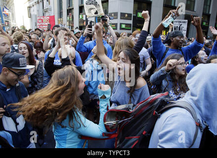 Protesters block traffic on lower Broadway near Wall Street during a rally and protest called 'Flood Wall Street' in New York City on September 22, 2014.  The protest was similar to the Occupy Wall Street set of protests but this one was more related to Climate Week and Global Warming Issues.   UPI/John Angelillo Stock Photo