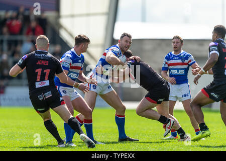 16th June 2019 ,  AJ Bell Stadium, Salford, England;  Betfred Super League, Round 18, Salford Red Devils vs Wakefield Trintiny ; Keegan Hurst of Wakefield Trinity is tackled Credit: Richard Long/News Images Stock Photo