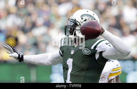 Pittsburgh Steelers Jason Worilds runs with New York Jets Michael Vick who  scrambles out of the pocket in the first half in week 10 of the NFL season  at MetLife Stadium in