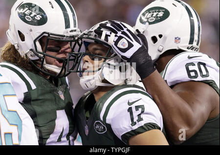 https://l450v.alamy.com/450v/typgjf/new-york-jets-greg-salas-celebrates-with-zach-sudfeld-and-dbrickashaw-ferguson-after-running-for-a-20-yard-touchdown-in-the-first-quarter-against-the-miami-dolphins-in-week-13-of-the-nfl-season-at-metlife-stadium-in-east-rutherford-new-jersey-on-december-1-2014-upi-john-angelillo-typgjf.jpg