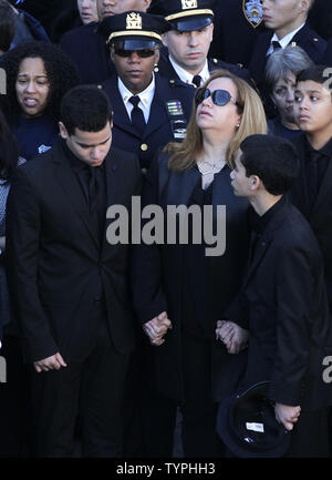 Matt Harvey, David Wright, Curtis Granderson from the Mets stand with  Justin and Jaden Ramos who join their mother Maritza Ramos and the family  of Wenjian Liu when they throw out the