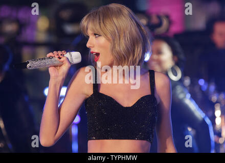 Taylor Swift performs in Times Square on New Year's Eve in New York City on December 31, 2014. Approximately one million revelers stood in Times Square to watch the ball drop and bring in the new year on the first day of 2015.       UPI/John Angelillo Stock Photo