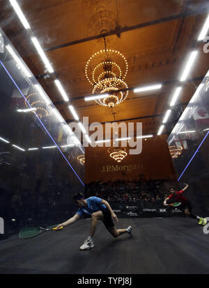 Chris Simpson of England hits a forehand in his match against Cesar Salazar of Mexico at JPMorgan Chase & Co.'s 18th annual  'Tournament of Champions' Professional Squash Tournament in Grand Central Terminal in New York City on January 16, 2015. The annual tournament is scheduled to continue through January 23rd.       Photo by John Angelillo/UPI Stock Photo