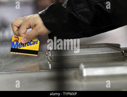 A man swipes his MetroCard to enter the subway on Houston Street in New York City on March 23, 2015. Commuters faced higher prices Monday morning after MTA fares went up over the weekend on subways, buses and commuter rails as well as at toll booths. Fare increases kicked in Sunday as part of a series of increases in recent years built into the cash-strapped MTA's budget.    Photo by John Angelillo/UPI Stock Photo