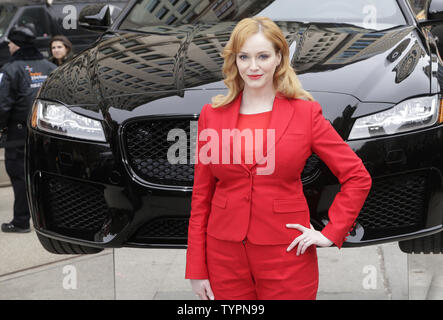 Christina Hendricks joins Jaguar in Manhattan's Flatiron Square on March 31, 2015 to reveal the all-new, 2016 XF sedan, floating above ground to spotlight its aluminum-intensive architecture, prior to its debut at the 2015 New York International Auto Show. First launched in North America in 2008 and receiving a complete redesign for the 2016 model year, the next generation Jaguar XF will be the second Jaguar model to feature the brand's advanced aluminum-intensive architecture and will come to market in fall, 2015.     Photo by John Angelillo/UPI Stock Photo