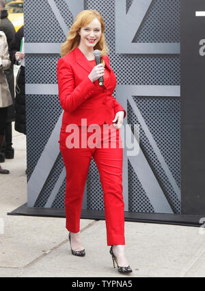 Christina Hendricks joins Jaguar in Manhattan's Flatiron Square on March 31, 2015 to reveal the all-new, 2016 XF sedan, floating above ground to spotlight its aluminum-intensive architecture, prior to its debut at the 2015 New York International Auto Show. First launched in North America in 2008 and receiving a complete redesign for the 2016 model year, the next generation Jaguar XF will be the second Jaguar model to feature the brand's advanced aluminum-intensive architecture and will come to market in fall, 2015.     Photo by John Angelillo/UPI Stock Photo