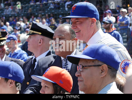 Matt Harvey, David Wright, Curtis Granderson from the Mets stand with  Justin and Jaden Ramos who join their mother Maritza Ramos and the family  of Wenjian Liu when they throw out the