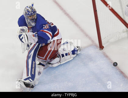 New York Rangers Henrik Lundqvist watches the puck from the stick of Tampa Bay Lightning Ondrej Palat go in for a goal in the third period in game 7 in the Eastern Conference Finals of the Stanley Cup Playoffs at Madison Square Garden in New York City on May 29, 2015. The Lightning defeated the Rangers 2-0 and advance to the Stanley Cup Finals.       Photo by John Angelillo/UPI Stock Photo