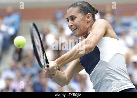 Flavia Pennetta of Italy hits a backhand to Roberta Vinci of Italy in the Women's Final in Arthur Ashe Stadium at the US Open Tennis Championships at the USTA Billie Jean King National Tennis Center in New York City on September 12, 2015.      Photo by John Angelillo/UPI Stock Photo