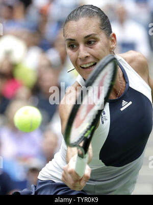 Flavia Pennetta of Italy hits a backhand to Roberta Vinci of Italy in the Women's Final in Arthur Ashe Stadium at the US Open Tennis Championships at the USTA Billie Jean King National Tennis Center in New York City on September 12, 2015. Pennetta wins the match 7-6, 6-2 becoming the first Italian women to win a US Open and also announced her retirement at the Trophy Ceremony.      Photo by John Angelillo/UPI Stock Photo