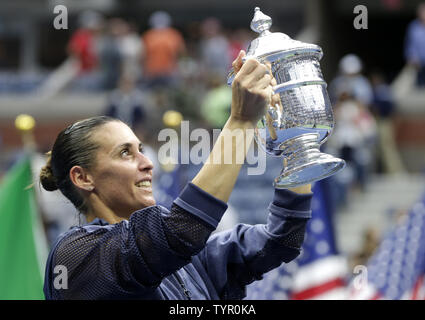 Flavia Pennetta of Italy holds the championship Trophy after her straight sets victory over Roberta Vinci of Italy in the Women's Final in Arthur Ashe Stadium at the US Open Tennis Championships at the USTA Billie Jean King National Tennis Center in New York City on September 12, 2015. Pennetta wins the match 7-6, 6-2 becoming the first Italian women to win a US Open and also announced her possible retirement at the Trophy Ceremony.     Photo by John Angelillo/UPI Stock Photo