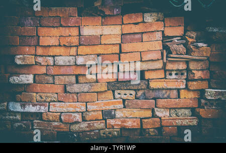 The stonewall from old bricks. It is retro style background or texture. Stock Photo