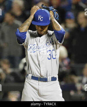 Kansas City Royals pitcher Yordano Ventura (30) talks with catcher Salvador  Perez in the fourth inning against the New York Mets in game 3 of the World  Series at Citi Field in