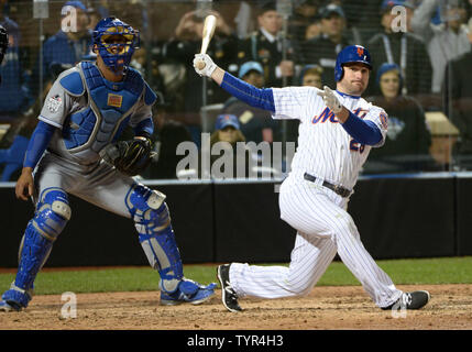 New York Mets second baseman Daniel Murphy (28) reacts after committing a  fielding error against the Kansas City Royals in the 12th inning in game  five of the World Series at Citi