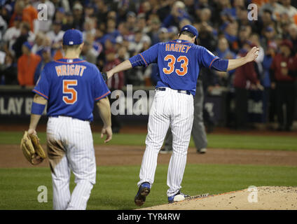 Matt Harvey, David Wright, Curtis Granderson from the Mets stand with  Justin and Jaden Ramos who join their mother Maritza Ramos and the family  of Wenjian Liu when they throw out the