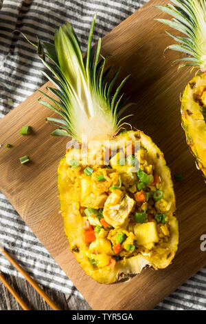 Homemade Pineapple Chicken Fried Rice in a Bowl Stock Photo