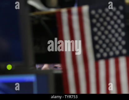 A trader works of the NYSE on New Years Eve at the opening bell at the New York Stock Exchange on Wall Street in New York City December 31, 2015. U.S. stocks traded lower at the open on the last day of trading for 2015.    Photo by John Angelillo/UPI Stock Photo