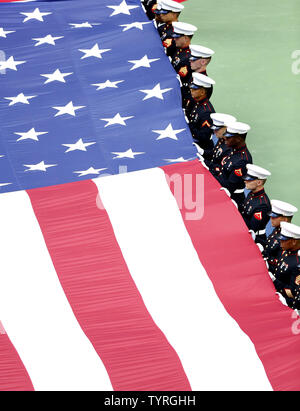 A giant American flag is displayed during the opening ceremony for the men's championship finals match at the US Open Tennis Championships at the USTA Billie Jean King National Tennis Center in New York City on September 11, 2016.     Photo by Monika Graff/UPI Stock Photo