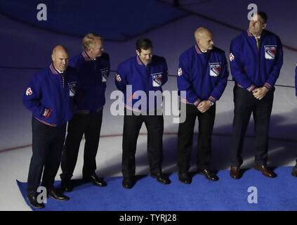 Former New York Rangers players Mark Messier, Brian Leetch, Mike Richter and Adam Graves from the 94 championship team stand on the ice before the New York Rangers play the opening game of the NHL season against the New York Islanders at Madison Square Garden in New York City on October 13, 2016.     Photo by John Angelillo/UPI Stock Photo