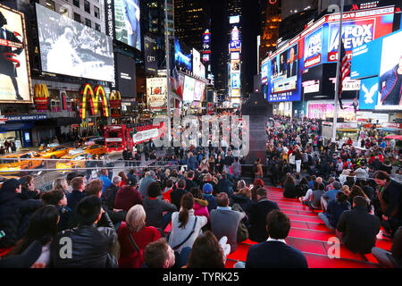 Crowds gather to watch the election returns being broadcasted on giant video screens in Times Square on Election Day on November 8, 2016 in New York City. Democratic nominee Hillary Clinton and Republican candidate Donald J. Trump are battling to become the 45th US president following contentious campaigns.     Photo by Monika Graff/UPI Stock Photo