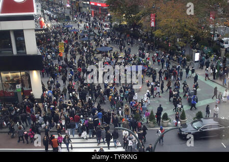Pedestrians crowd the sidewalks near the Macy's department store in Herald Square on Black Friday in New York City on November 25, 2016. For over a decade, Black Friday has traditionally been the official start to the busy buying binge sandwiched between Thanksgiving and Christmas.     Photo by John Angelillo/UPI Stock Photo