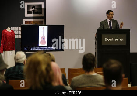 An acoustic guitar signed by early Top of the Pos Guests including The Beatles and The Rolling Stones is auctioned when 'TCM Presents Rock and Roll Through The Lens' sale at Bonhams New York auction house on March 27, 2017 in New York City. The sale featured Jimi Hendrix's recorder and the Abbey Road Studios recording console used to record Pink Floyd's album 'The Dark Side of the Moon'     Photo by John Angelillo/UPI Stock Photo