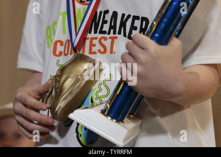 Connor Slocombe from Alaska wears the golden sneaker trophy around his neck after winning the 42nd annual National Odor-Eaters Rotten Sneaker Contest at Ripley's Believe It or Not in New York City on March 28, 2017. The Rotten Sneaker Contest began in 1974 as a promotion created by a Montpelier Vermont sporting goods owner who wanted to advertise a new line of athletic shoes.    Photo by John Angelillo/UPI Stock Photo