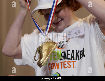 Connor Slocombe from Alaska puts the golden sneaker trophy around his neck after winning the 42nd annual National Odor-Eaters Rotten Sneaker Contest at Ripley's Believe It or Not in New York City on March 28, 2017. The Rotten Sneaker Contest began in 1974 as a promotion created by a Montpelier Vermont sporting goods owner who wanted to advertise a new line of athletic shoes.    Photo by John Angelillo/UPI Stock Photo