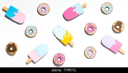 Summer background with donuts and ice cream on white Stock Photo