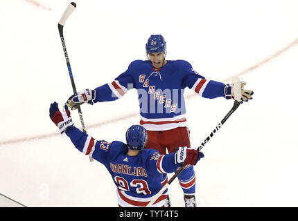 New York Rangers Mika Zibanejad celebrates with Chris Kreider after he scores a second period goal against the  Colorado Avalanche in the opening game of the 2017 NHL season at Madison Square Garden in New York City on October 5, 2017.     Photo by John Angelillo/UPI Stock Photo