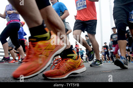 Runners cross the Verrazano Narrows Bridge when they compete in the NYRR TCS New York City Marathon in New York City on November 5, 2017. 50,000 runners from the Big Apple and around the world raced through the five boroughs on a course that winds its way from the Verrazano Bridge before crossing the finish line by Tavern on the Green in Central Park.       Photo by Dennis Van Tine/UPI Stock Photo