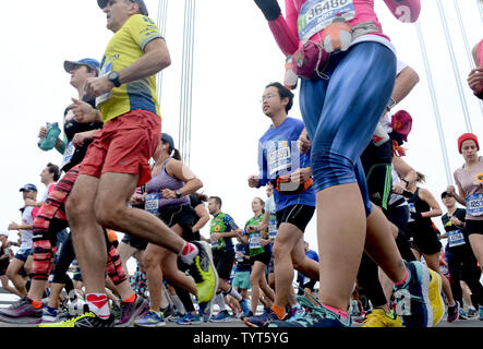 Runners cross the Verrazano Narrows Bridge when they compete in the NYRR TCS New York City Marathon in New York City on November 5, 2017. 50,000 runners from the Big Apple and around the world raced through the five boroughs on a course that winds its way from the Verrazano Bridge before crossing the finish line by Tavern on the Green in Central Park.       Photo by Dennis Van Tine/UPI Stock Photo