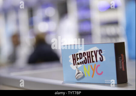 Shoppers walk through a new Hershey's Store when a Hershey's Chocolate World Attraction unveils a sensory experience grand opening in Times Square in New York City on December 14, 2017. The Hershey's Chocolate World Attraction will feature an oversized Hershey's Kisses 'Plume'cutting, Hershey's Melted Hot Chocolate toast and a special gift for the first 1,000 attendees.       Photo by John Angelillo/UPI Stock Photo