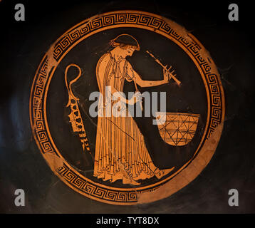 Flutist in front of a food basket depicted in the Attic red-figure drinking cup by the Douris Painter dated from around 480 BC on display in the Altes Museum in Berlin, Germany. Stock Photo