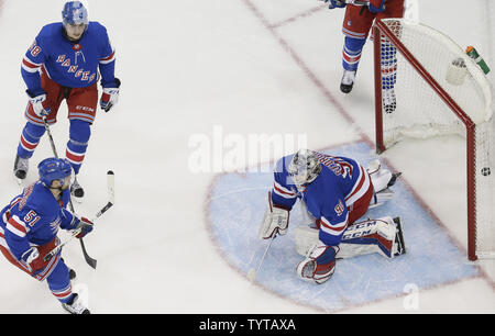 New York Rangers Alexandar Georgiev, David Desharnais and John Gilmour react after Minnesota Wild Mikael Granlund scores a goal in the first period at Madison Square Garden in New York City on February 23, 2018.     Photo by John Angelillo/UPI Stock Photo