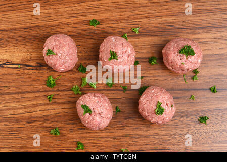 top view raw meatballs with parsley Stock Photo